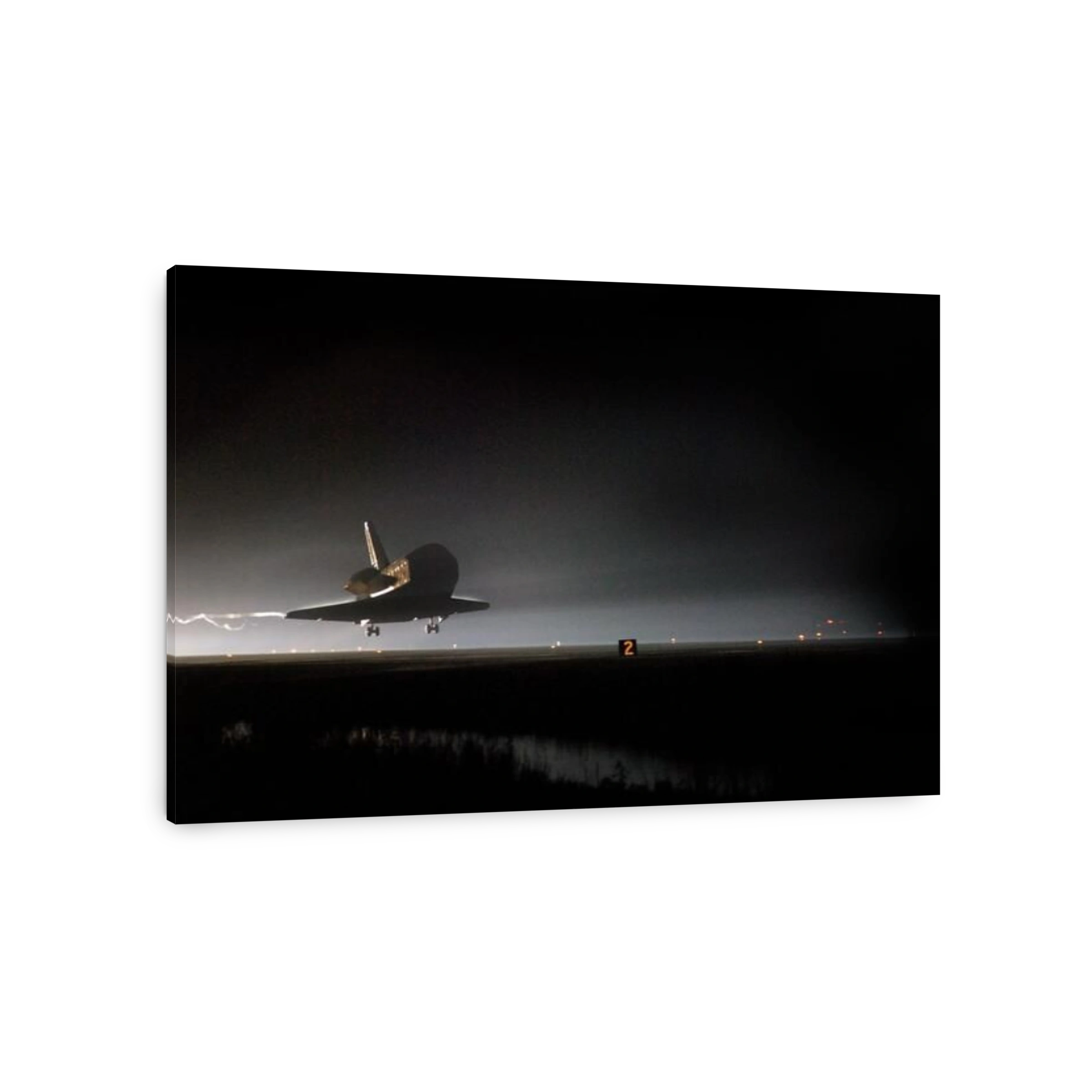 Space Shuttle Endeavour Touchdown STS-123. As night falls on NASA's Kennedy Space Center, Space Shuttle Endeavour is moments away from touchdown on Runway 15 at the Shuttle Landing Facility to end the STS-123 mission, a 16-day flight to the International 