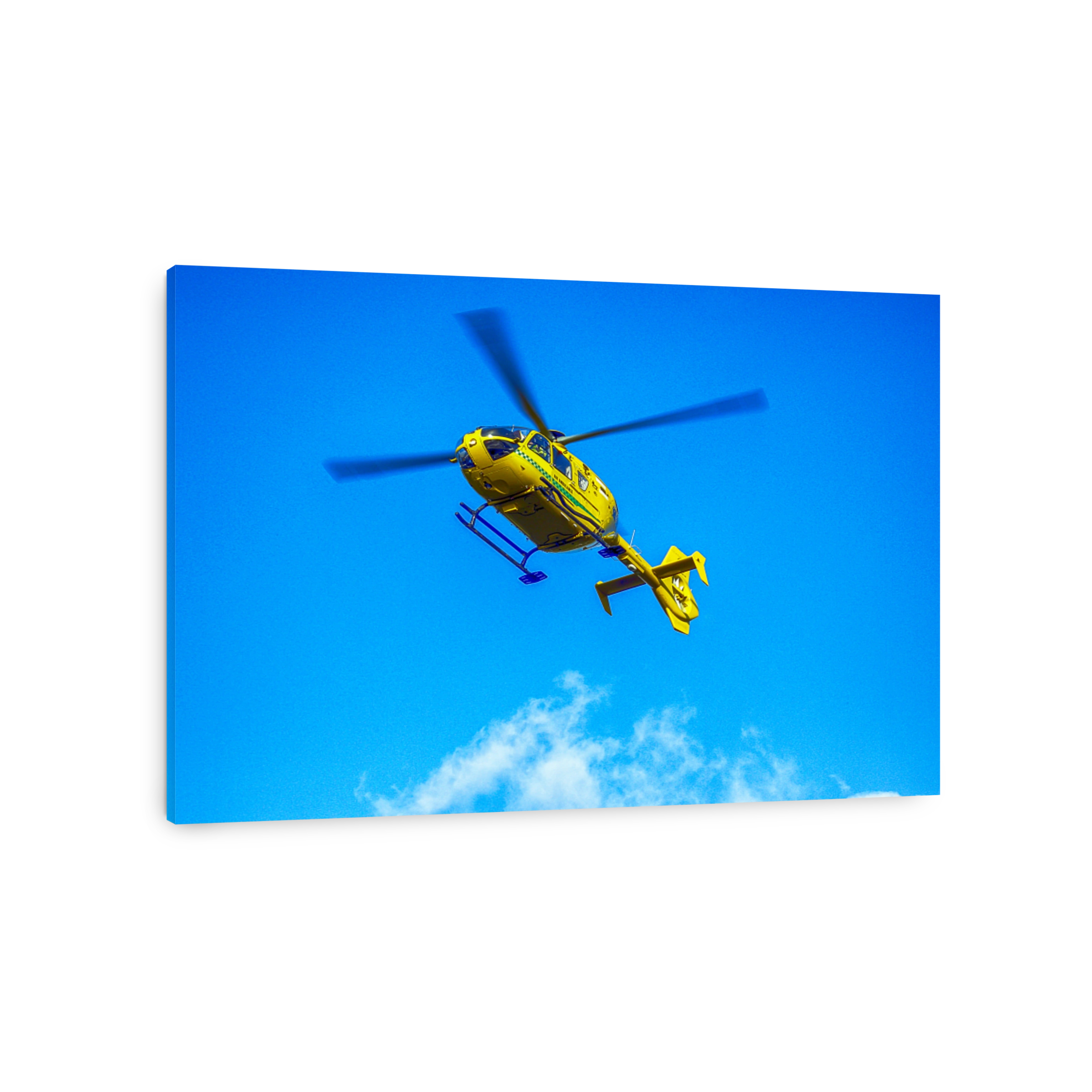 Air Ambulance helicopter in the sky above Sherborne, UK