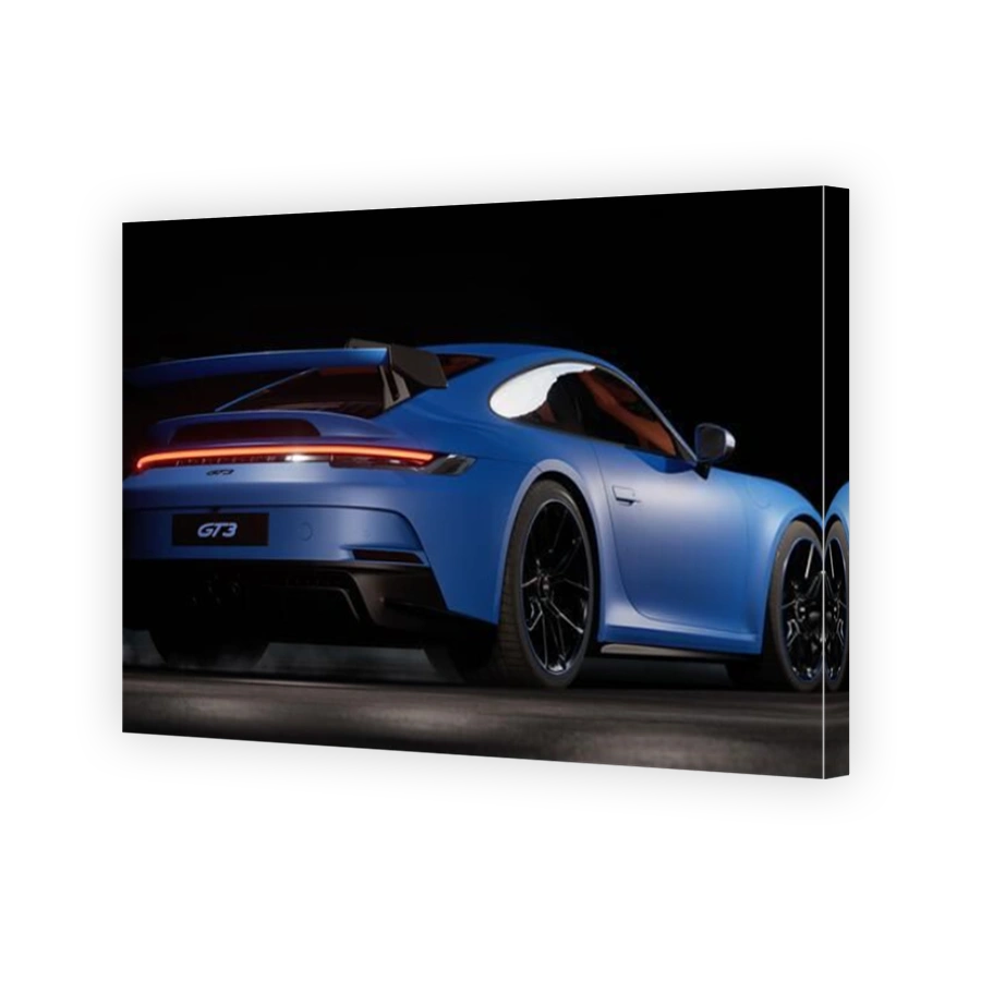 Porsche 911 GT3 in a dark garage