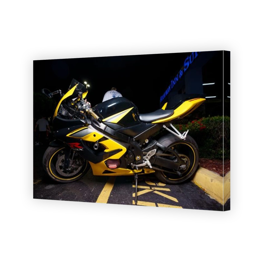 Fort Lauderdale, FL, USA - October 11, 2023: Night stock image of a yellow and black Suzuki gsxr sport bike motorcycle