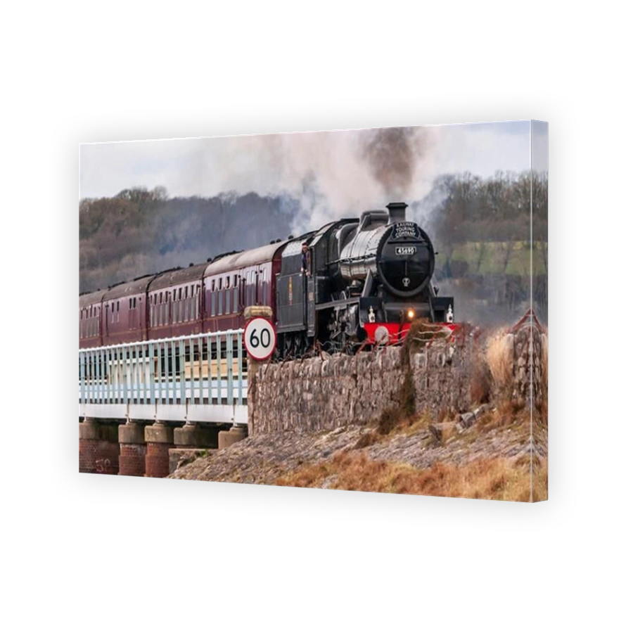 Restored steam engine Leander crossing the Arnside viaduct over the river Kent with the Cumbrian Coast Express.