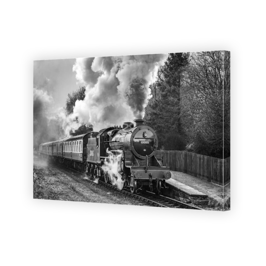 The Mogul steam locomotive The Crab pictured on the East Lancashire Railway At Irwell Vale halt.