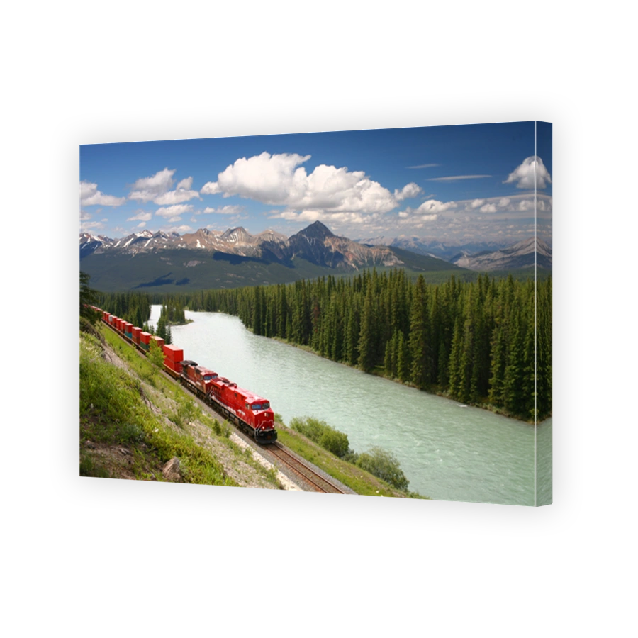 Freight train moving along river