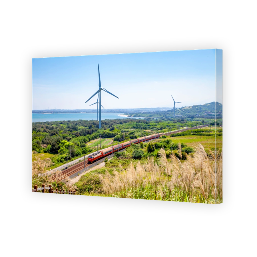 rainway at the coastline with wind turbine