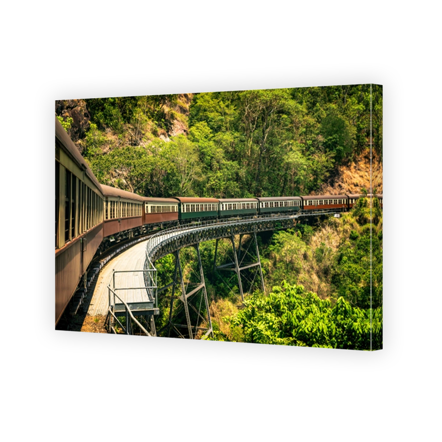 The view of the vintage train running across the viaduct in Kuranda Scenic Railway