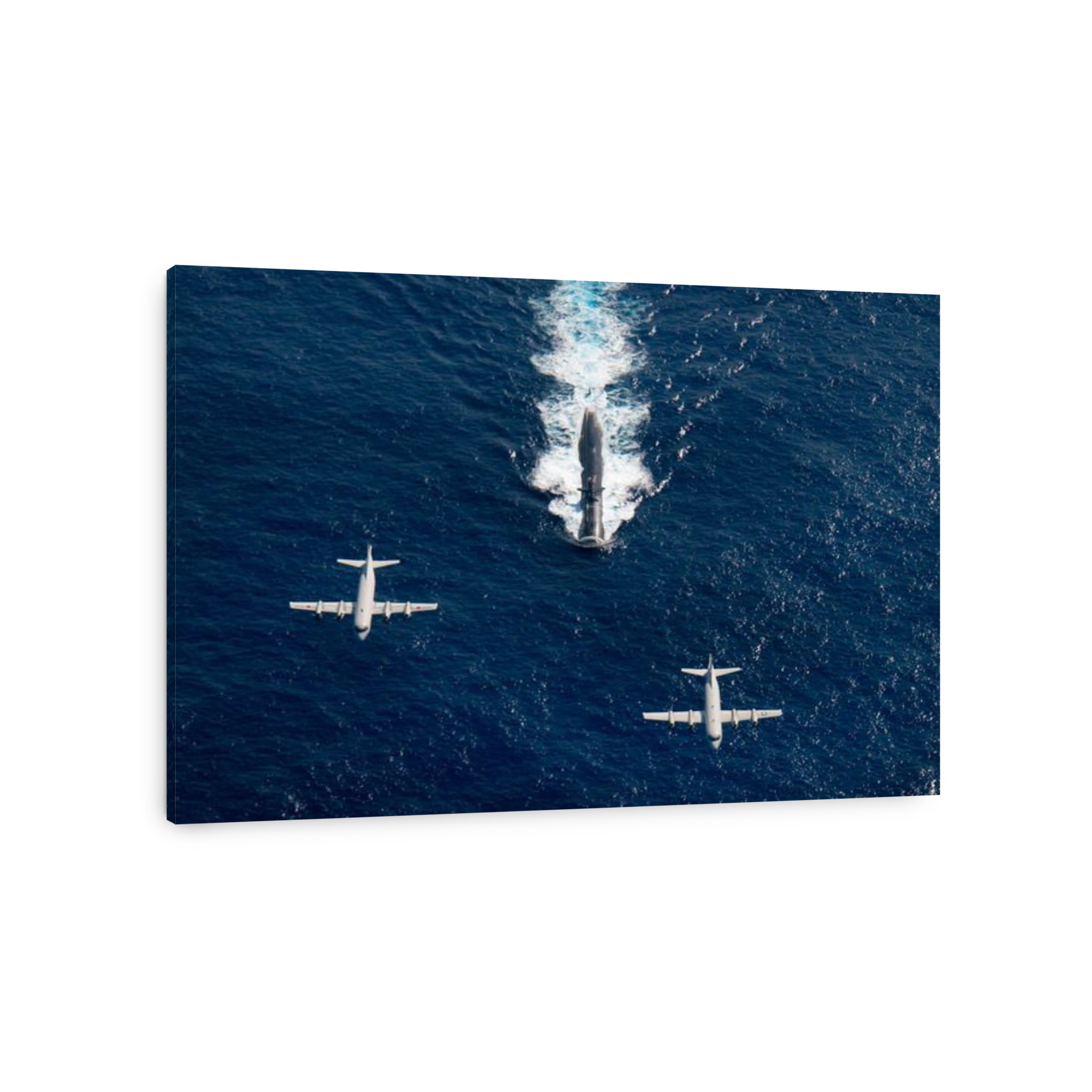 Two P-3 Orion maritime surveillance aircraft fly over attack submarine USS Houston.