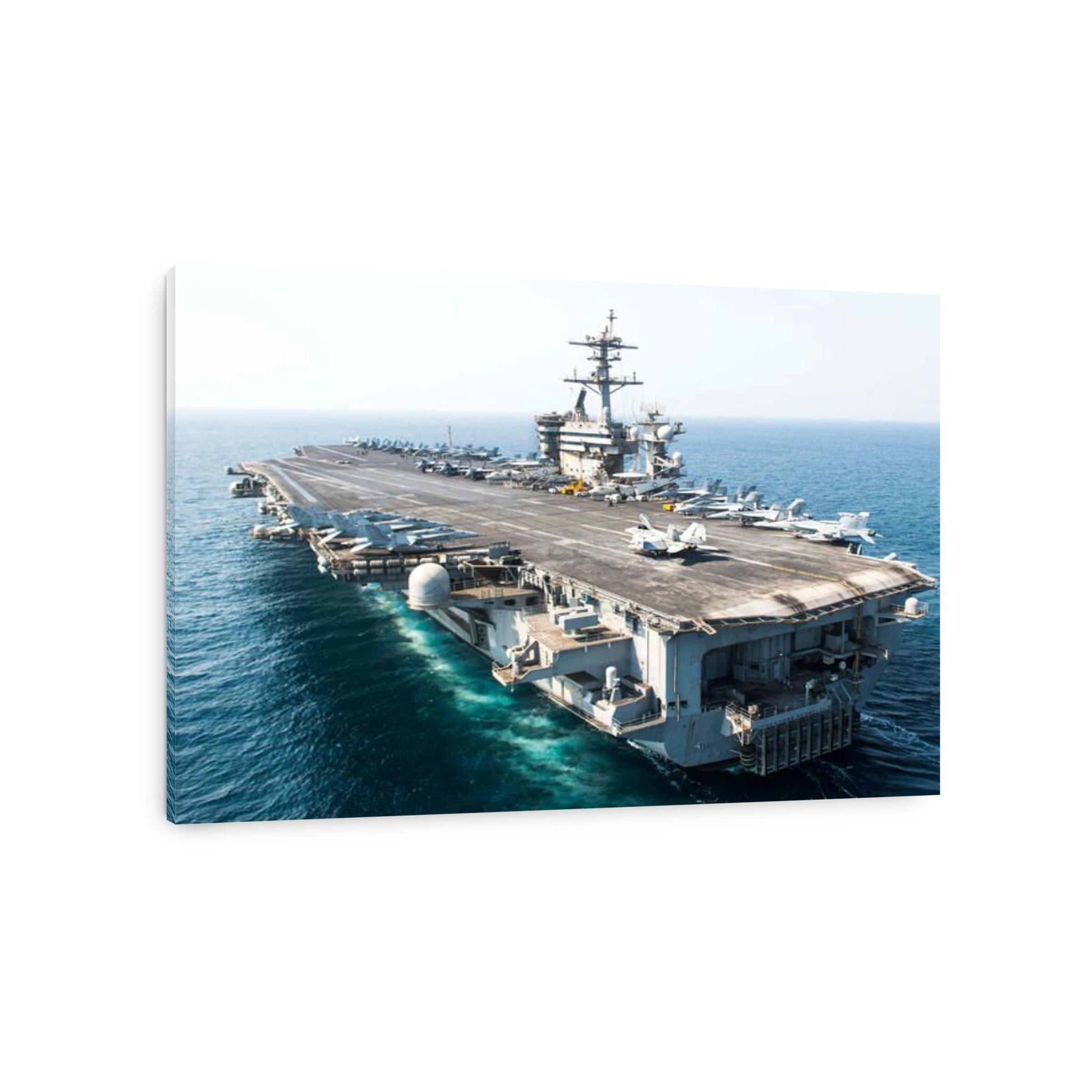 The aircraft carrier USS Theodore Roosevelt transits the Arabian Gulf.