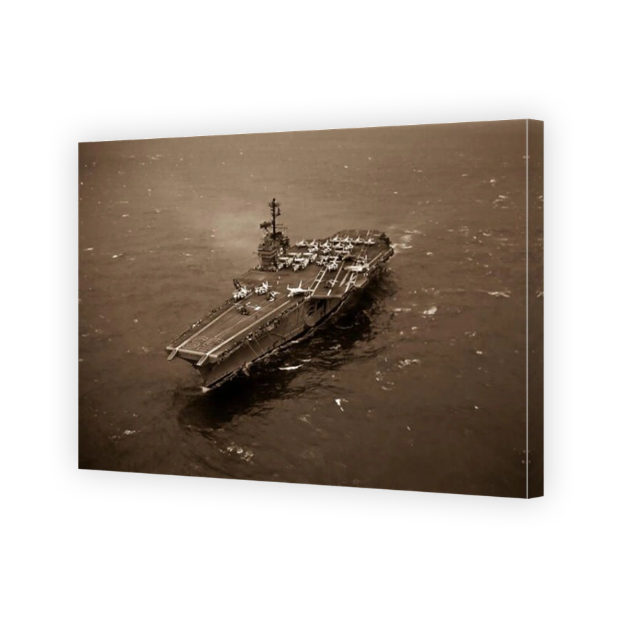 An aerial port bow view of the Forrestal Class Aircraft Carrier, USS FORRESTAL (CVA 59)