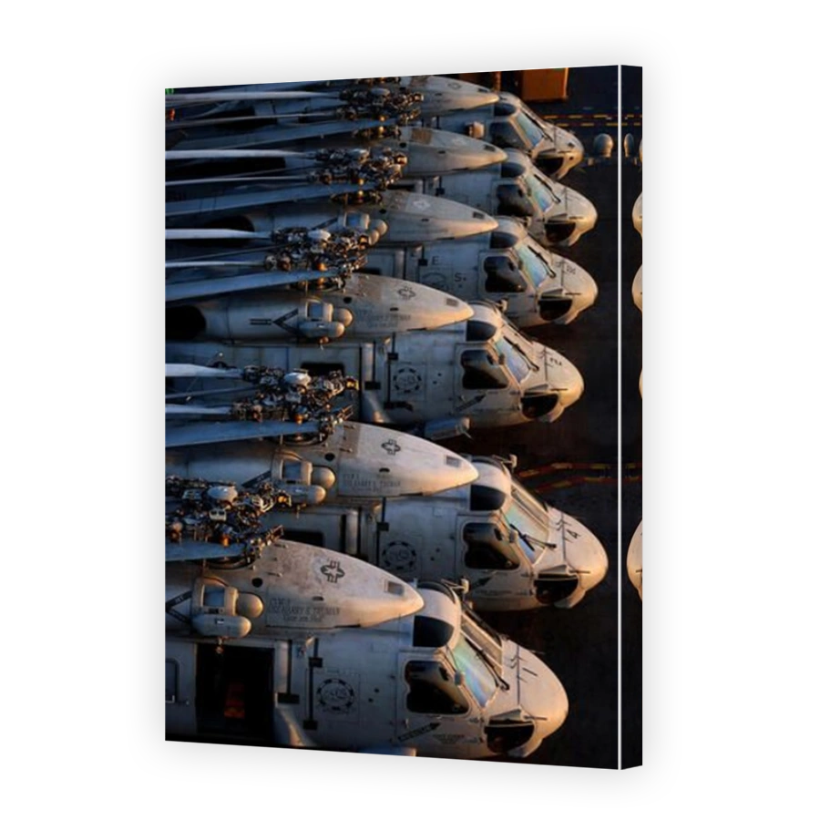 SH-60 Seahawk helicopters sit on the flight deck aboard the Nimitz-class aircraft carrier USS Harry S. Truman (CVN 75) in the early morning sun. U.S. Navy photo/ Photographer's Mate Airman Ricardo J. Reyes