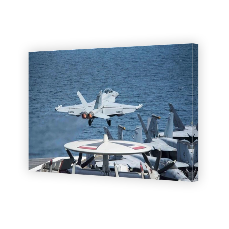 An EA-18G Growler launches from the flight deck of the aircraft carrier USS George H.W. Bush.