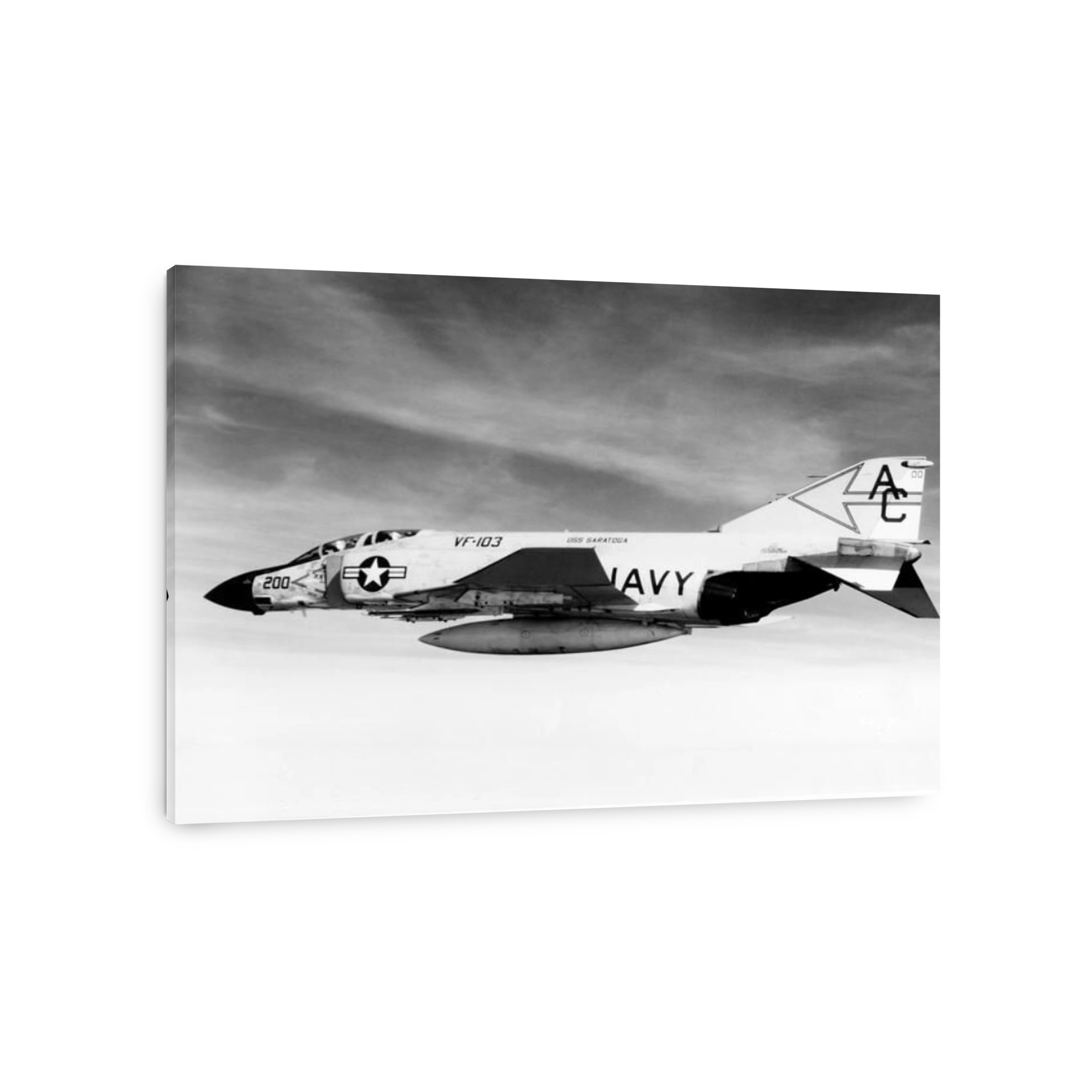 An F-4J Phantom fighter aircraft flying over the Mediterranean.