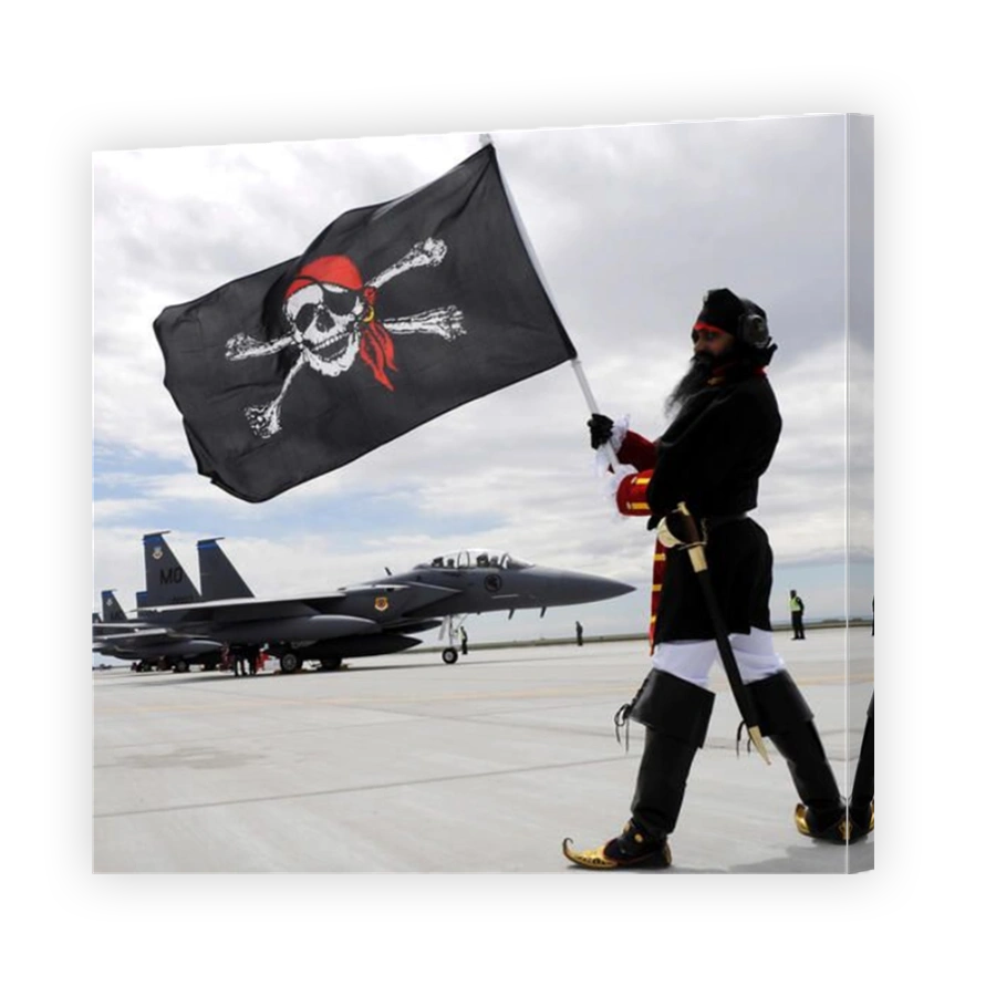 The 428th Fighter Squadron Buccaneer mascot poses in front of three F-15SG fighter jets