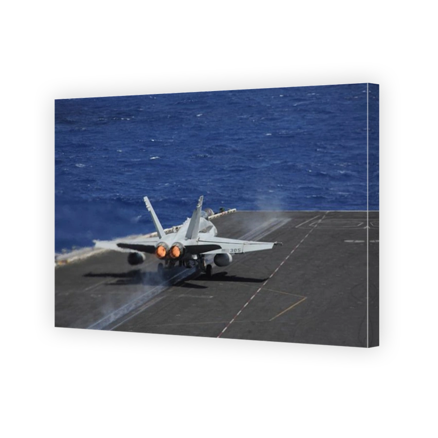 Atlantic Ocean, July 2, 2013 - An F/A-18C Hornet launches from the aircraft carrier USS Dwight D. Eisenhower.