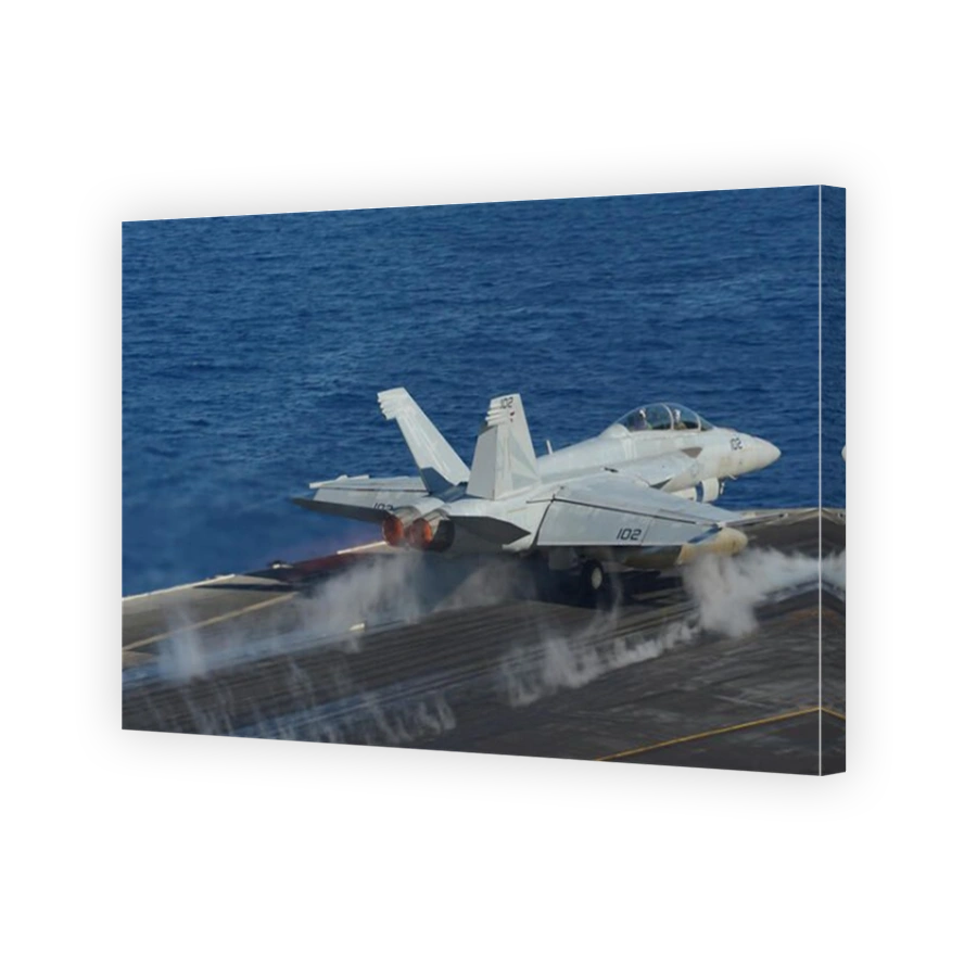 Mediterranean Sea, October 23, 2013 - An F/A-18F Super Hornet launches from the flight deck of the aircraft carrier USS Nimitz (