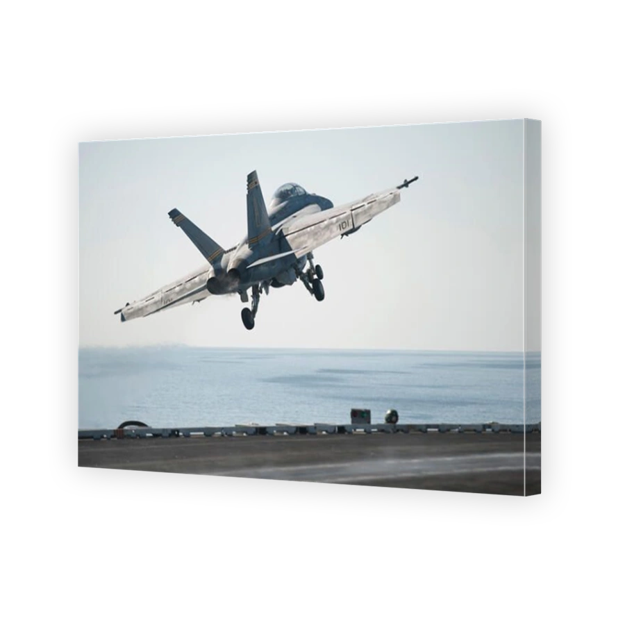 Gulf of Oman, March 19, 2014 - An F/A-18F Super Hornet launches from the flight deck of the aircraft carrier USS Harry S. Truman