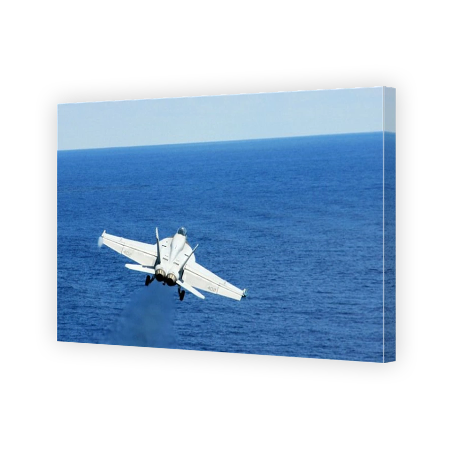 South China Sea, July 9, 2012 - An F/A-18E Hornet launches from the aircraft carrier USS George Washington.