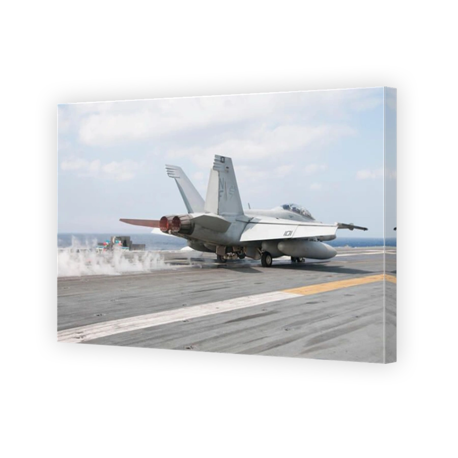 Philippine Sea, November 26, 2013 - An F/A-18F Super Hornet launches from the flight deck of the U.S. Navy's forward-deployed ai