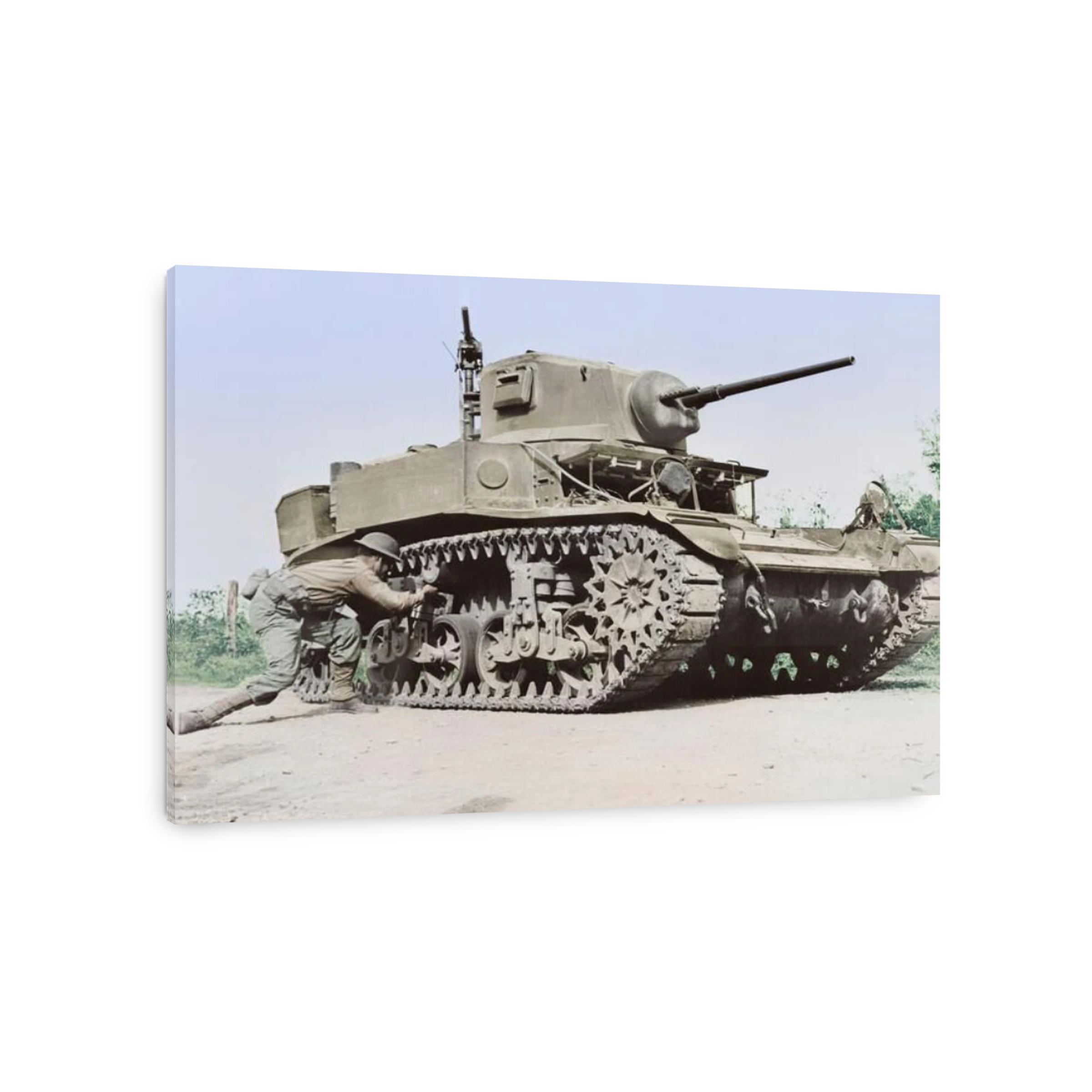 A soldier places a 29 pound TNT statchel charge on a light tank, circa 1942.