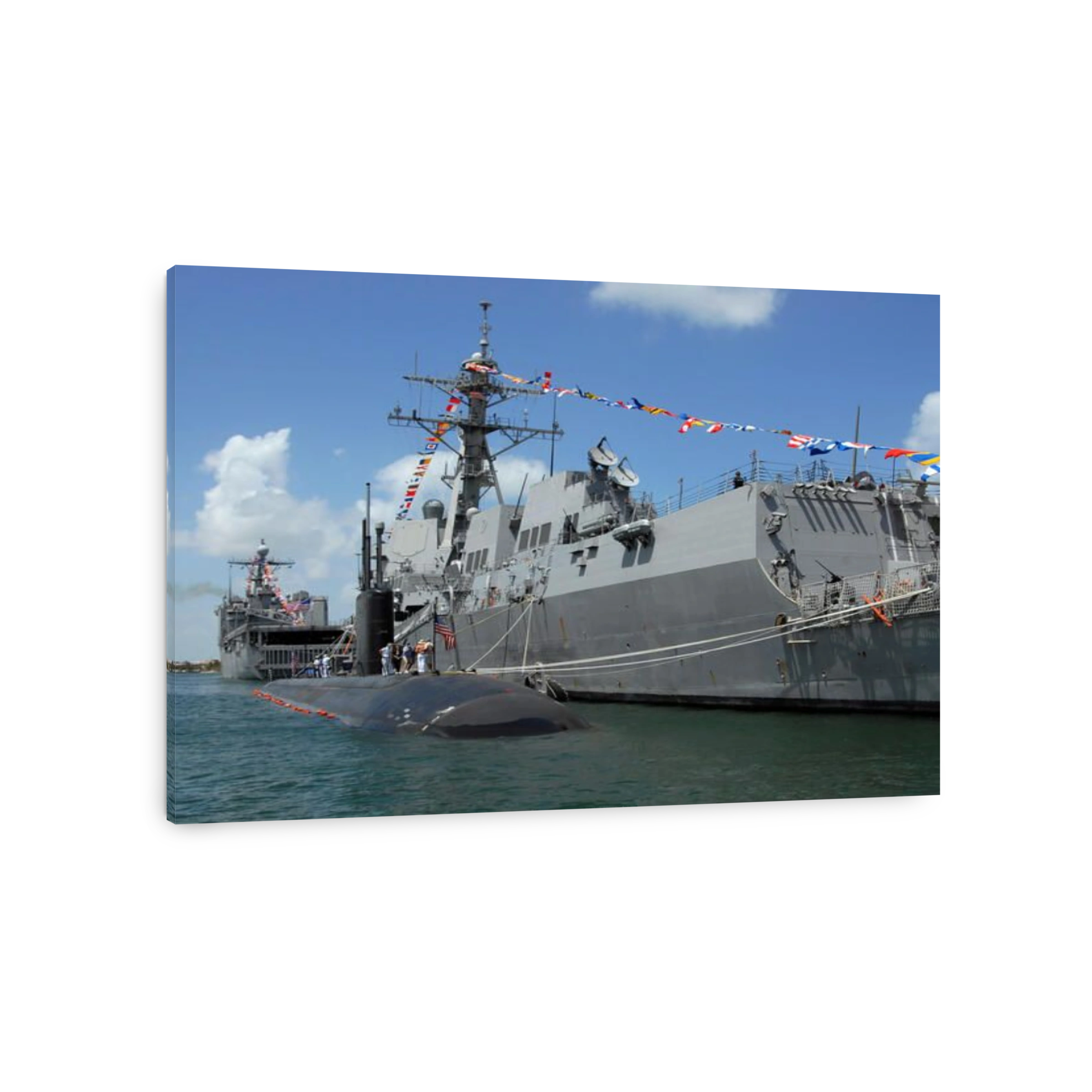 Attack submarine USS Toledo moored next to the guided-missile destroyer USS Forrest Sherman.