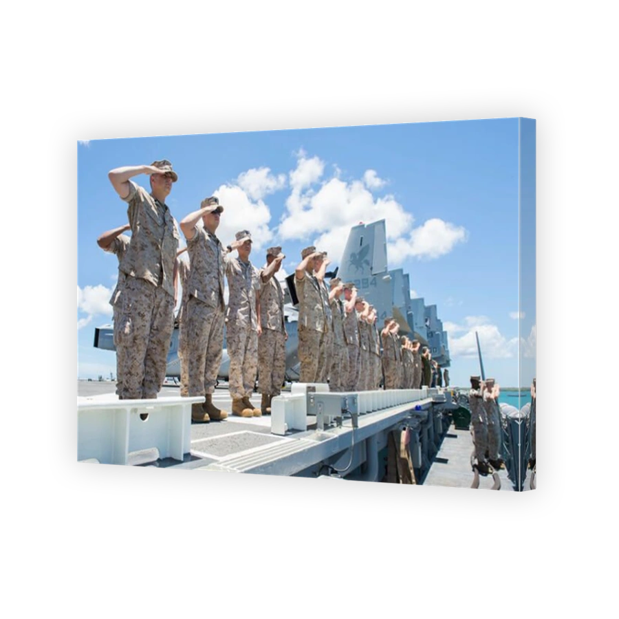 U.S. Marines and Sailors render honors aboard USS Peleliu.