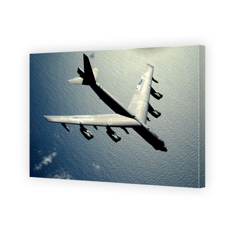 A B-52 Stratofortress in flight over the Pacific Ocean.