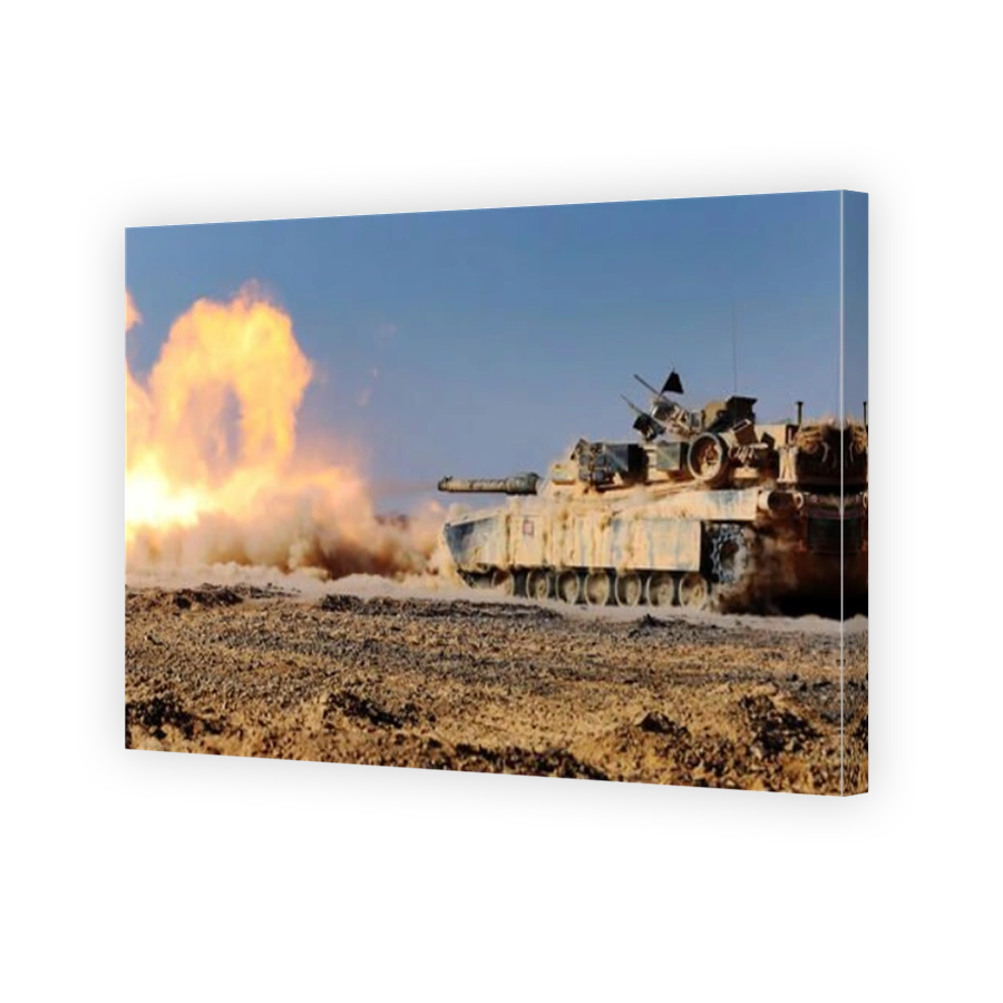 An M1A1 Abrams Main Battle Tank fires its 120 mm smoothbore cannon.