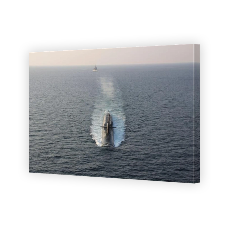Guided-missile submarine USS Georgia transits the Strait of Hormuz with USS Philippine Sea.