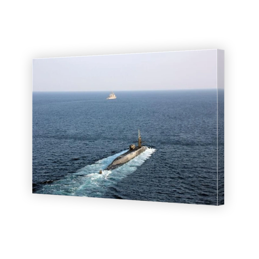 Guided-missile submarine USS Georgia transits the Strait of Hormuz with USS Port Royal.