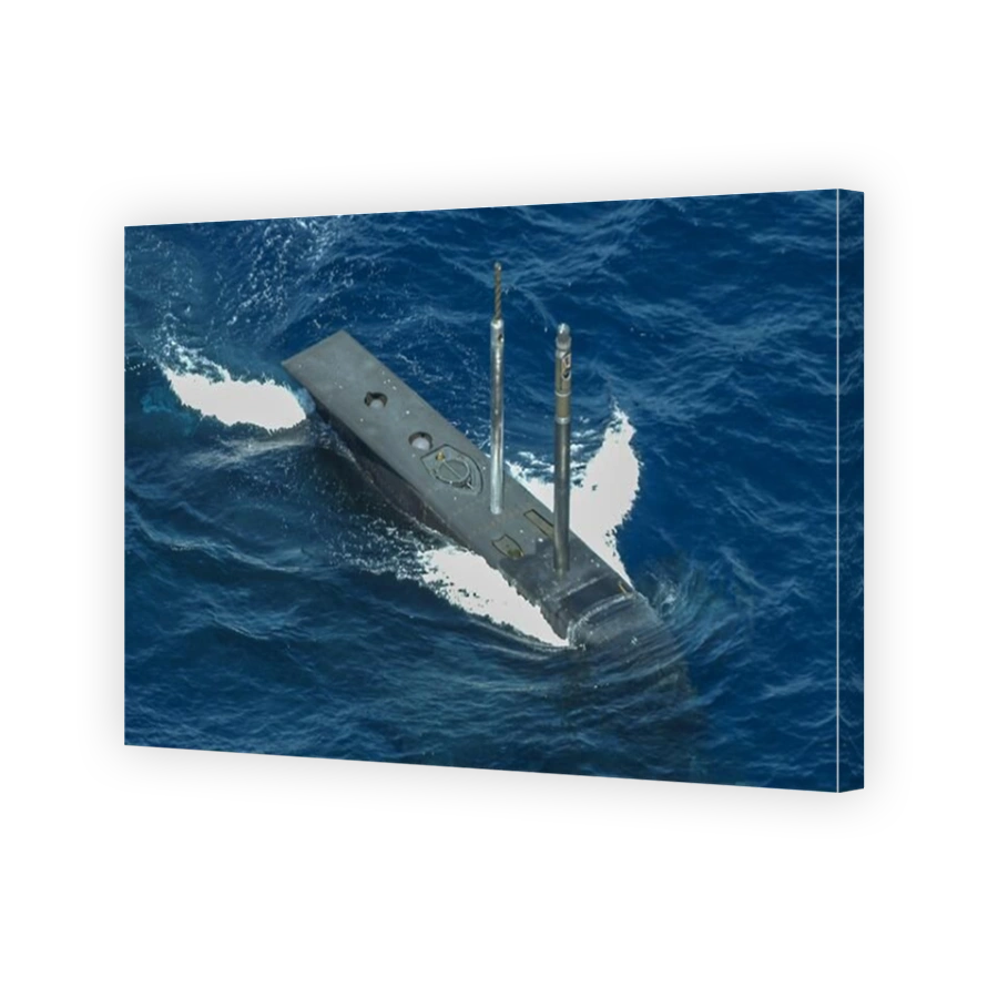 An aerial view of the sail of HMAS Rankin, a Royal Australian Navy Collins Class submarine submerging beneath the Indian Ocean.