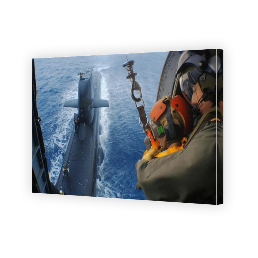 Winching operations from a Seahawk helicopter, to an Australian Navy Collins Class diesel electric submarine. Called Vertical replenishment.