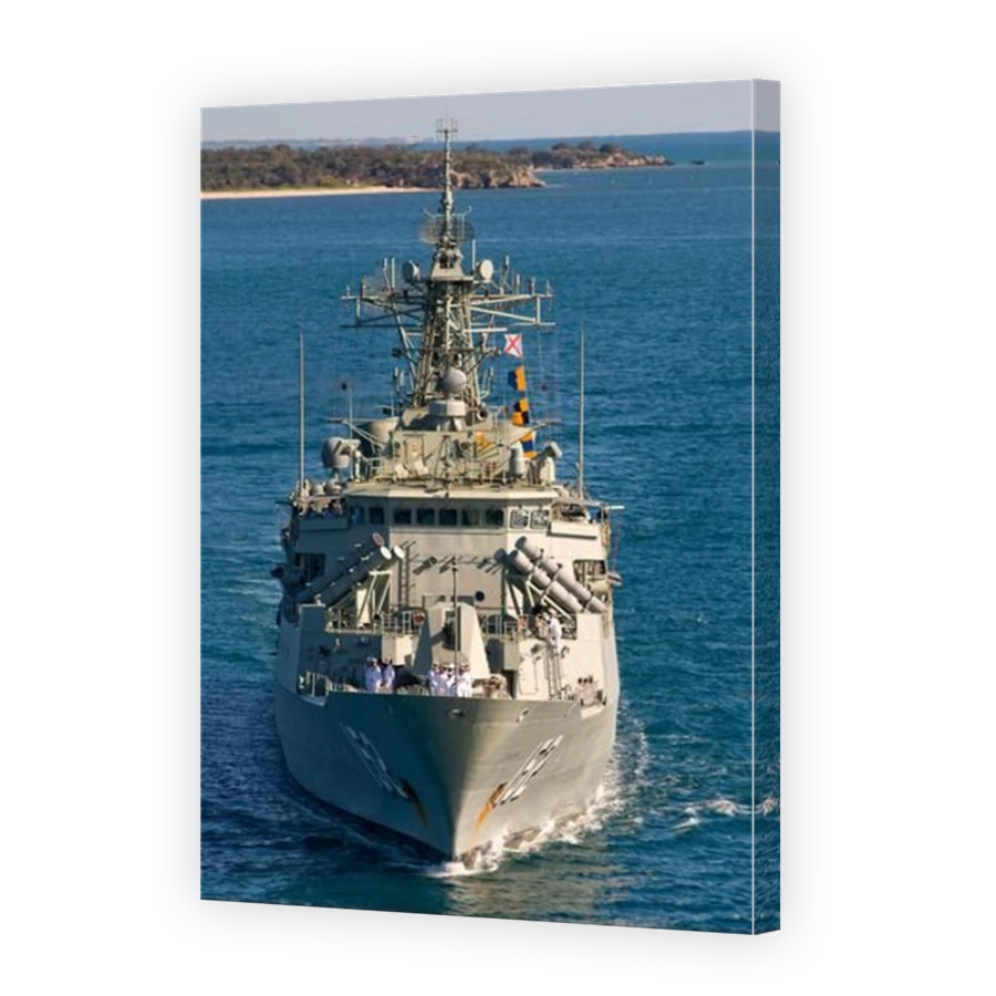 A Royal Australian Navy frigate berthing at Western Australia's Garden Island naval base, following an overseas deployment.