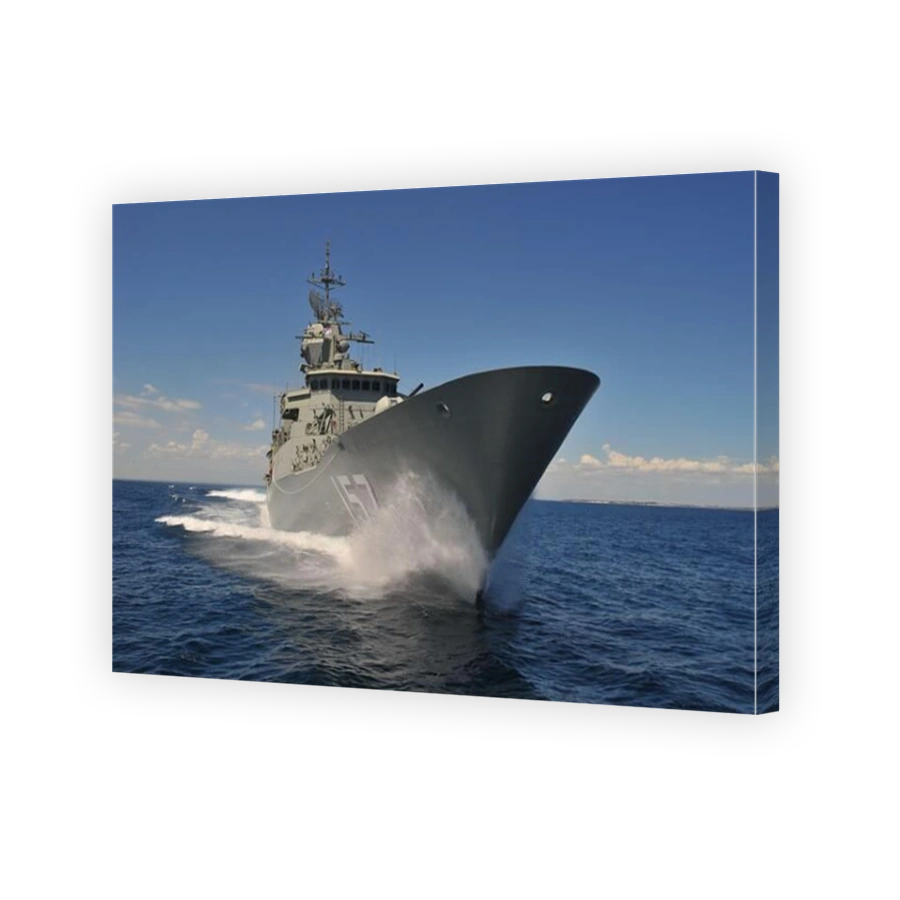 HMAS Perth, an Australian navy frigate at sea performing speed trials.