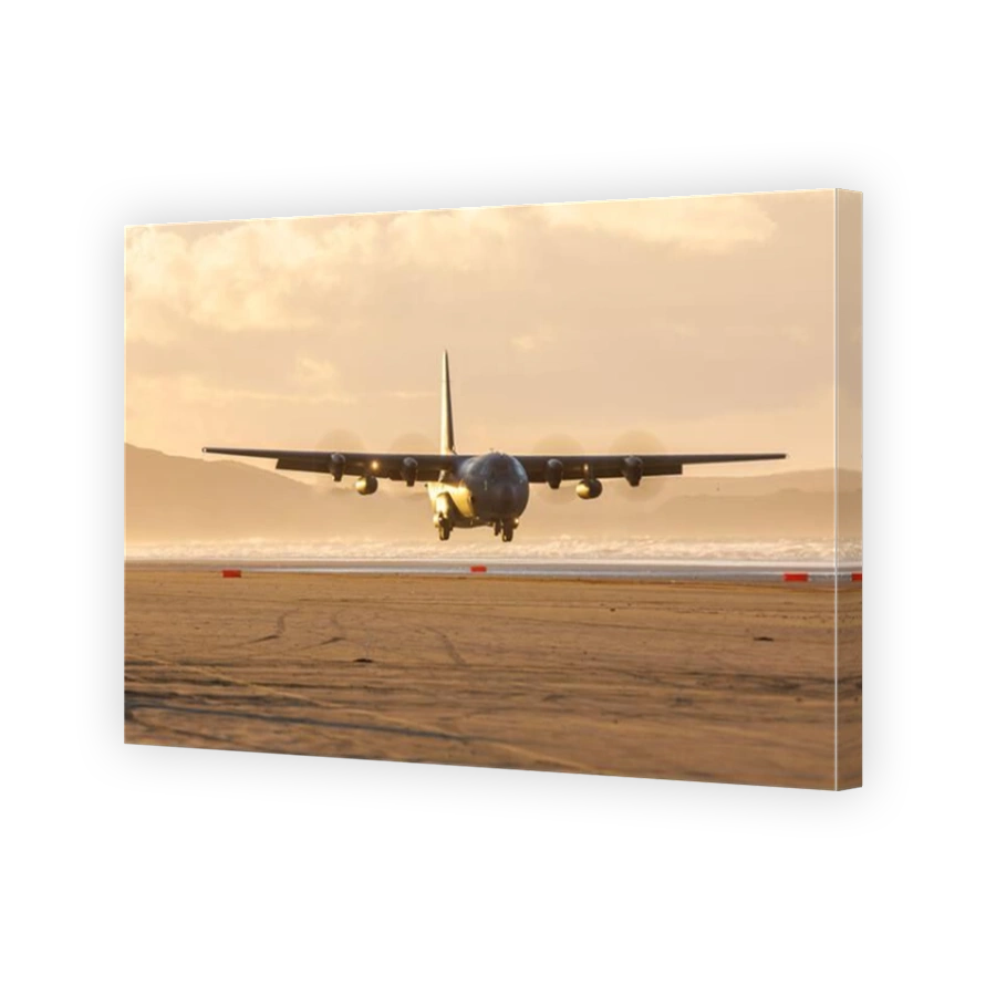 Royal Australian Air Force RAAF landing on Pembrey Sands with a C130 Hercules in South Wales managed by the RAF Tactical Air Traffic Controllers